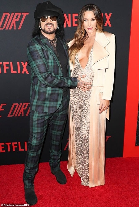 A picture of Nikki Sixx and Courtney Sixx showing the baby bump of Courtney.
